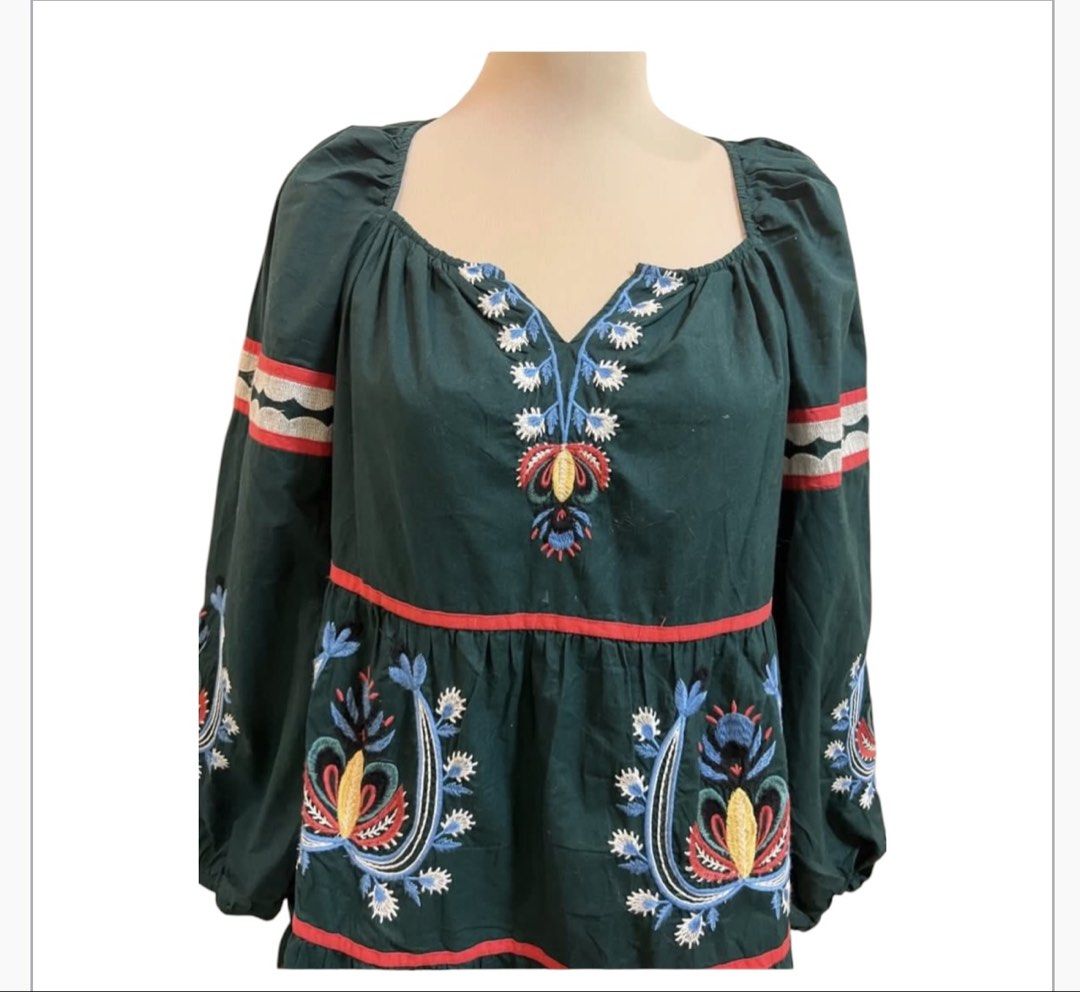 Green Embroidered Tiered Mini Dress (Category: Dresses) located in Quezon City. Submitted by letsdeclutter101 (Listing ID 1454706501, Image 2). Description: - Fun & bohemian green mini dress - width 38' -length 35' - Features colorful embroidery all over - Flattering square neckline - Stylish long puff sleeves - Trendy tiered design with eye-catching red trim - Unique back cutout with adjustable tie closure - Ideal for casual outings, parties, or