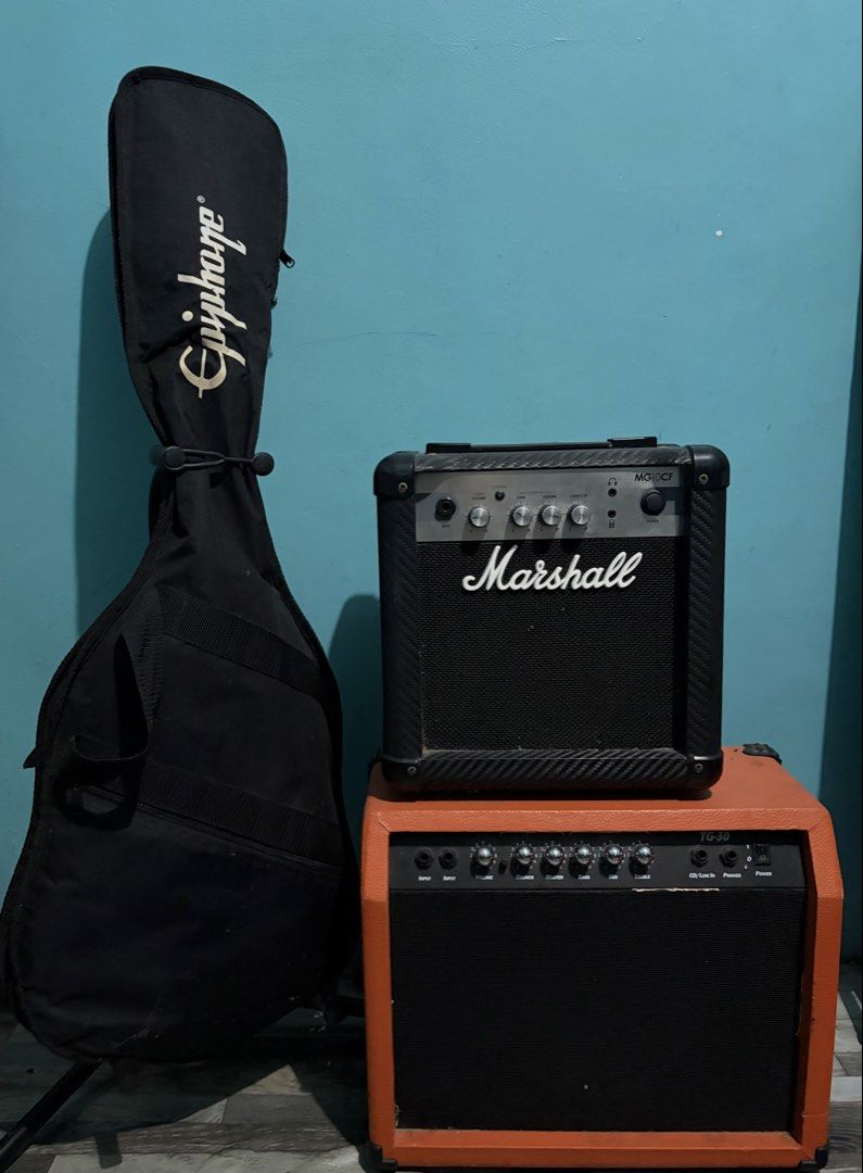 Epiphone Les Paul with Amps (Category: Musical Instruments) located in Quezon City. Submitted by del.qc (Listing ID 1454576403, Image 1). Description: Epiphone Les Paul Special electric guitar - Classic black finish - Iconic Les Paul body shape Includes: Marshall Amplifier 10w and Deviser Amp 30w Minor rust issues due to storage but 100% working, ready for the next owner..