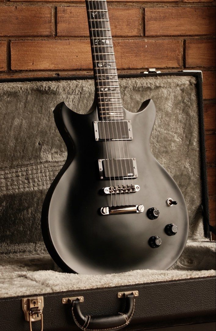 ESP Eclipse DC STD RARE (Category: Musical Instruments) located in Singapore. Submitted by azgear (Listing ID 1454614457, Image 1). Description: A rare find from the ESP catalogue(Not the cheaper E-II line). Made in japan, in a sleek satin black finish with stunning black pearl binding all around and fretboard inlays. All stock gotoh hardware, EMG 81 60 for that crushing tone. Mahogany body and neck with a ebony fretboard. Comes with the original