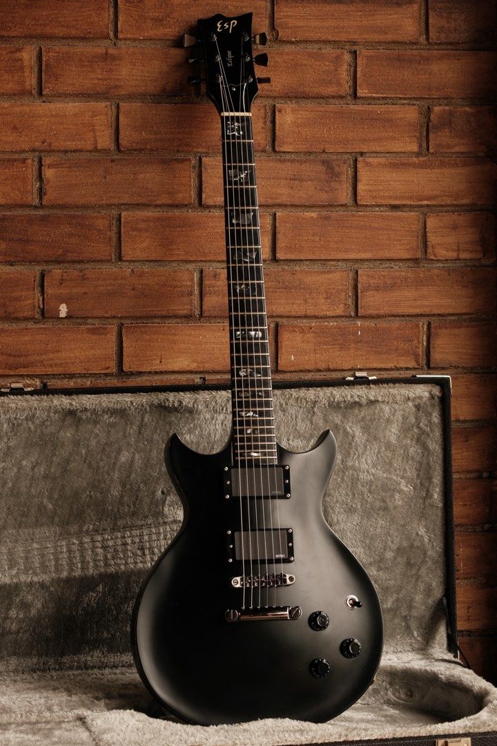 ESP Eclipse DC STD RARE (Category: Musical Instruments) located in Singapore. Submitted by azgear (Listing ID 1454614457, Image 2). Description: A rare find from the ESP catalogue(Not the cheaper E-II line). Made in japan, in a sleek satin black finish with stunning black pearl binding all around and fretboard inlays. All stock gotoh hardware, EMG 81 60 for that crushing tone. Mahogany body and neck with a ebony fretboard. Comes with the original