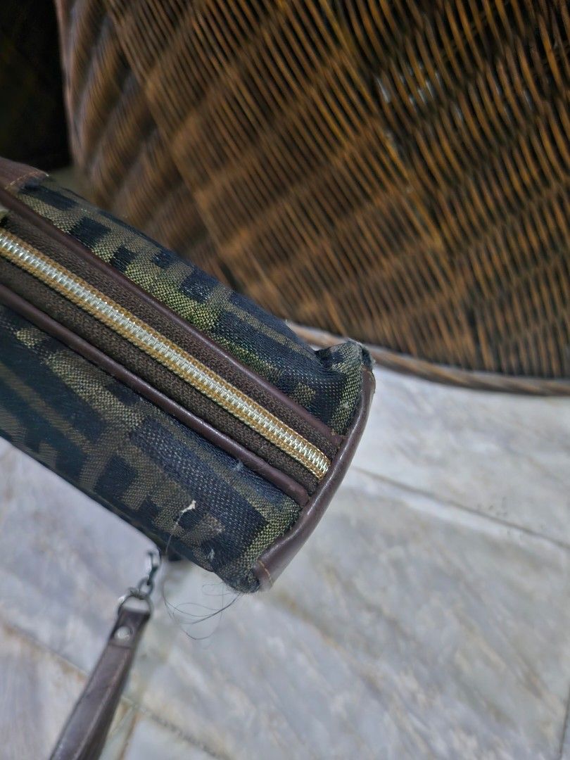 Zucca Canvas Pouch Wristlet (Category: Luxury Bags & Wallets) located in Pinamalayan. Submitted by braveheartfiftyfive (Listing ID 1454670823, Image 3). Description: - Classic brown leather trim and wrist strap - Secure zipper closure - Interior card slots for organization - Minor signs of wear on leather trim and corners, adding character - Perfect for carrying your essentials in style.