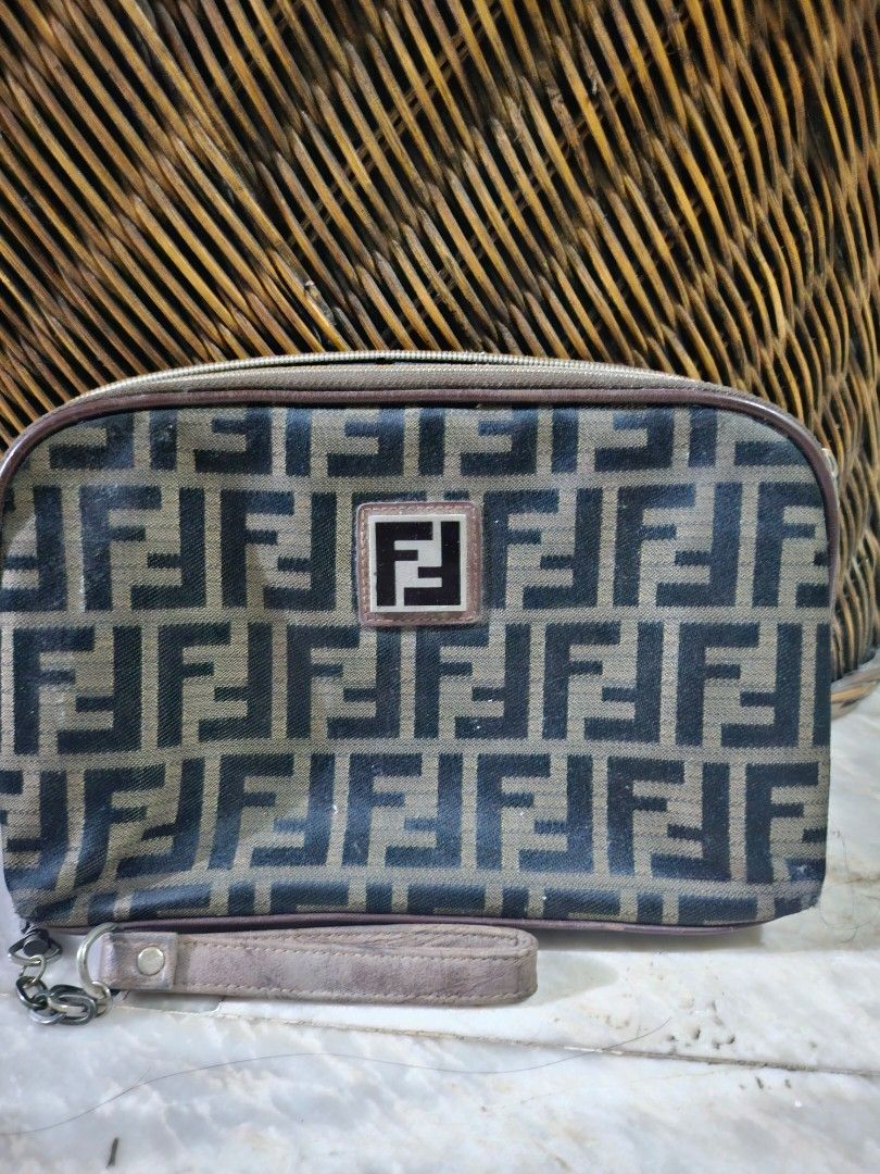 Zucca Canvas Pouch Wristlet (Category: Luxury Bags & Wallets) located in Pinamalayan. Submitted by braveheartfiftyfive (Listing ID 1454670823, Image 1). Description: - Classic brown leather trim and wrist strap - Secure zipper closure - Interior card slots for organization - Minor signs of wear on leather trim and corners, adding character - Perfect for carrying your essentials in style.