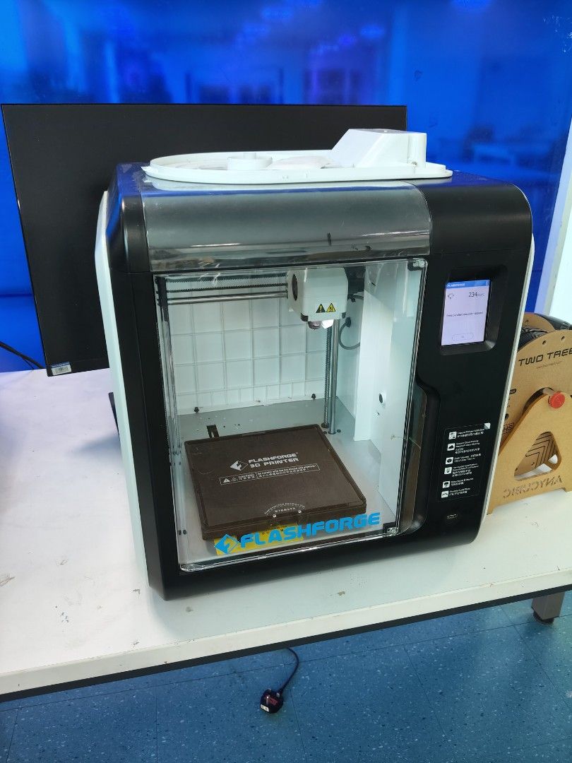 FlashForge 3D Printer (Category: Printers, Scanners & Copiers) located in Kuala Lumpur. Submitted by yauboonhan (Listing ID 1454690474, Image 2). Description: - FlashForge 3D printer - Sleek black and white casing - Features a clear front door - Currently mid-print, showing its operational status - Build plate is included and ready - Perfect for your next creative project free 3pcs print bed sheets.