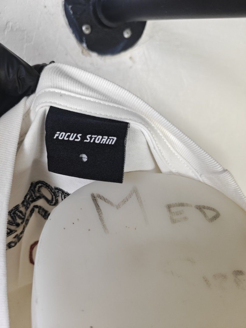 Focus Storm (Category: Tshirts & Polo Shirts ) located in Rizal. Submitted by itsmecle0 (Listing ID 1454748252, Image 3). Description: Size:L Width:23 in inches tape measurement Length:27.5 in inches tape measurement Color:white Color rate:9.5 Condition Rate:9.5 Issue:May light spot stain Other details: fully embroid neck makapal tela solid din.