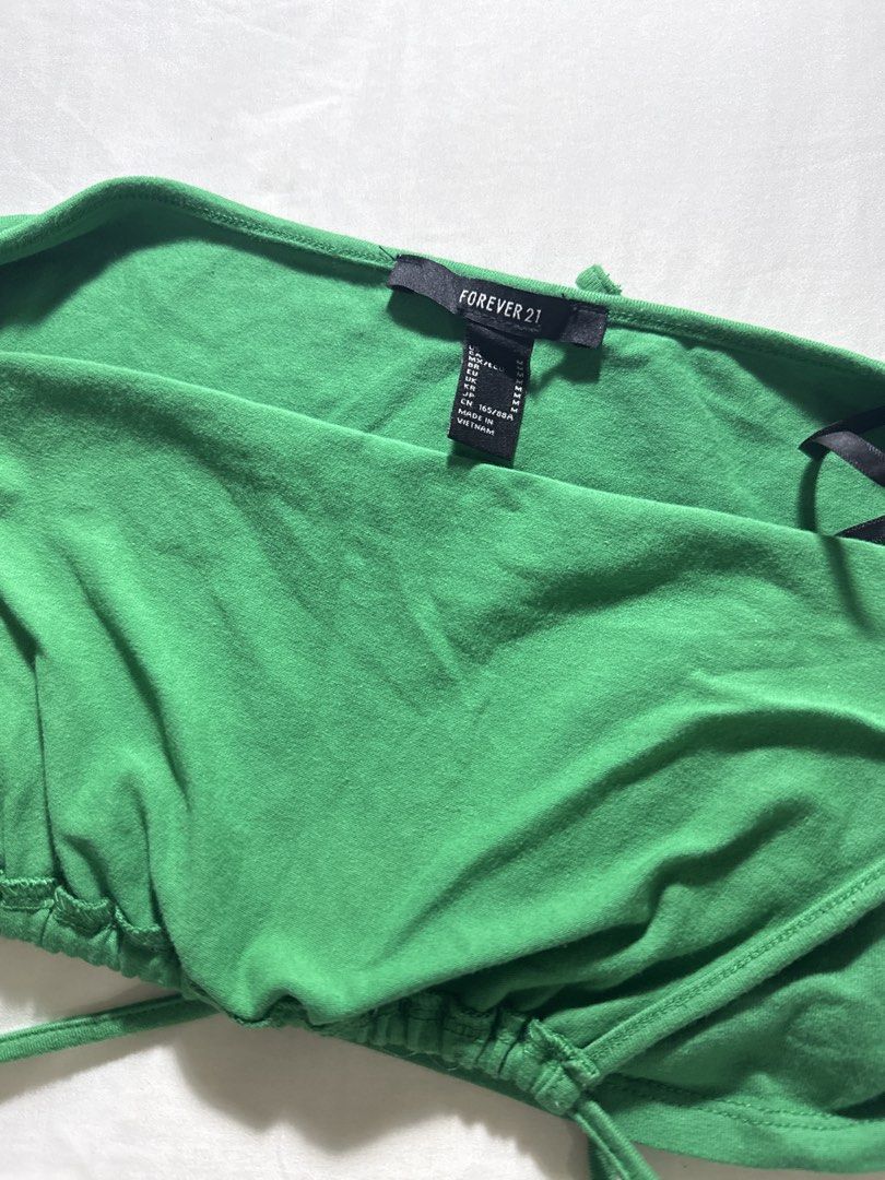 Forever 21 Green Halter Neck Crop Top - Size M (Category: Sleeveless) located in Quezon City. Submitted by minispirea (Listing ID 1454718575, Image 3). Description: • On hand & ready to ship • More photos/videos available upon request • Pay as you order • No returns or exchanges Location: Quezon City / BGC Delivery: • Weekdays — same-day evening or next-day delivery due to work • Weekends — anytime For proof of previous transactions, check @minis