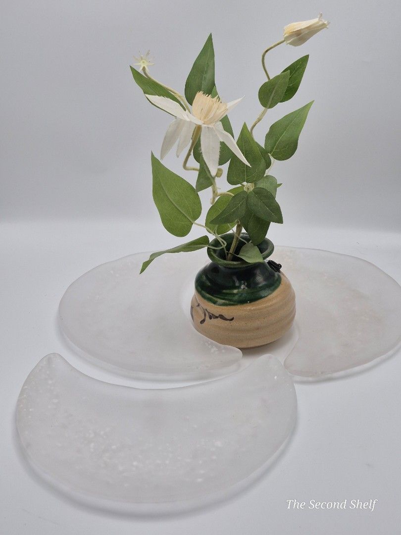 Frosted Glass Display Plates (Category: Dinnerware & Cutlery) located in Santa Rosa. Submitted by thesecondshelf (Listing ID 1454621215, Image 2). Description: Frosted Glass Display Plates PHP 800 3-piece set of frosted glass decorative display plates with a soft, organic shape and textured white finish. Size: Approximately 10 x 5 inches Includes: 3 glass pieces Vase and flowers are not included. Condition: Good used condition. Please see photos 