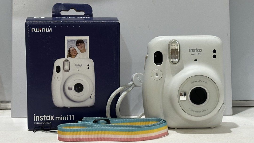 Fujifilm Instax Mini 11 Ice White (Category: Cameras) located in Baguio. Submitted by itstrishhhh (Listing ID 1454622678, Image 1). Description: 📷 Fujifilm Instax Mini 11 — Ice White 💰 ₱3,000 negotiable for sure buyers Condition: 9/10 • Fully functional • Well-maintained • Clean lens & camera body • No major dents or scratches • ⚠️ Slight yellowing/discoloration on some surrounding/outer areas due to age • Original box has some signs of storage