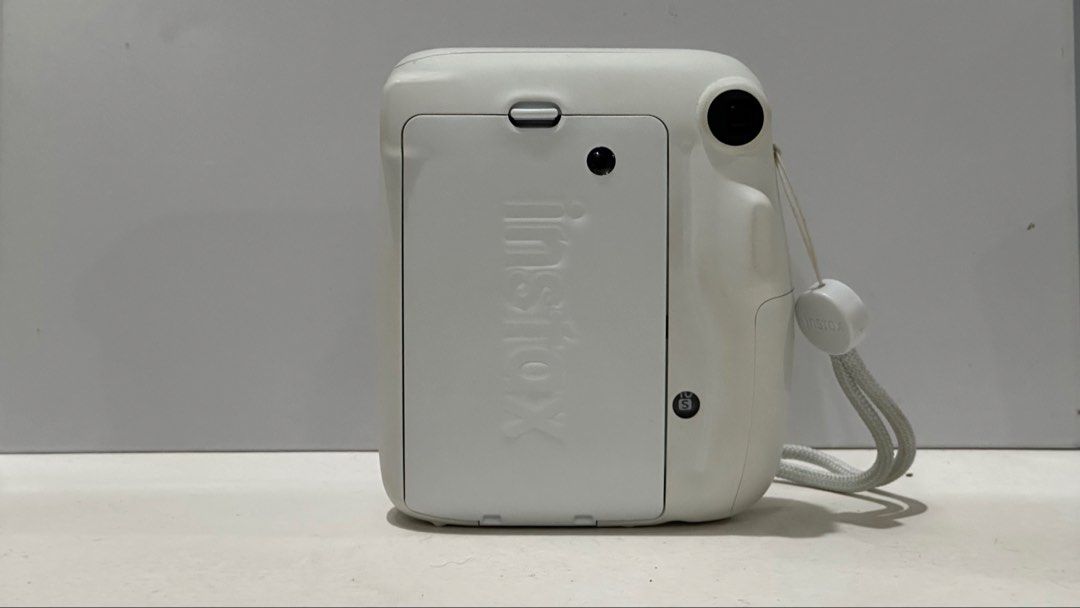 Fujifilm Instax Mini 11 Ice White (Category: Cameras) located in Baguio. Submitted by itstrishhhh (Listing ID 1454622678, Image 3). Description: 📷 Fujifilm Instax Mini 11 — Ice White 💰 ₱3,000 negotiable for sure buyers Condition: 9/10 • Fully functional • Well-maintained • Clean lens & camera body • No major dents or scratches • ⚠️ Slight yellowing/discoloration on some surrounding/outer areas due to age • Original box has some signs of storage