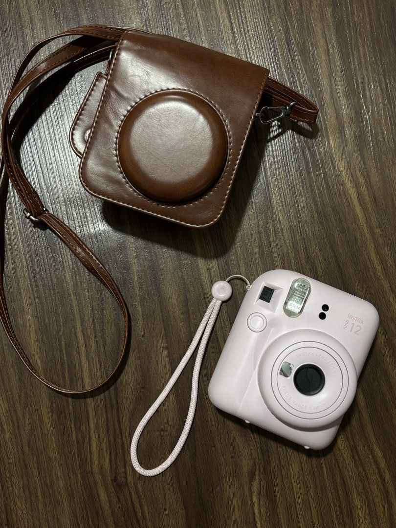 Fujifilm Instax Mini 12 Pink (Category: Cameras) located in Marikina City. Submitted by larafinds (Listing ID 1454741660, Image 1). Description: Rfs: Decluttering INSTAX MINI 12 PINK - Rarely used - No issue, lady - With film pang laman, can use for test shots Inclusions: - Unit with battery - Leather Case 📍Marikina City.