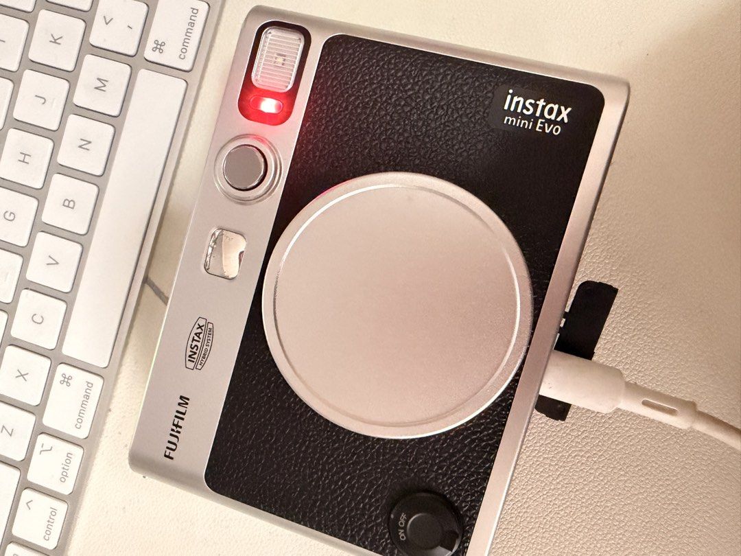 Fujifilm Instax Mini Evo Hybrid Instant Camera (Category: Cameras) located in Pasig City. Submitted by janegar (Listing ID 1454639838, Image 3). Description: - Fujifilm Instax Mini Evo: Hybrid digital and instant camera - Save photos digitally before printing - Comes with a clear protective case & camera cover - Ideal for capturing and instantly printing memories - In excellent working condition.