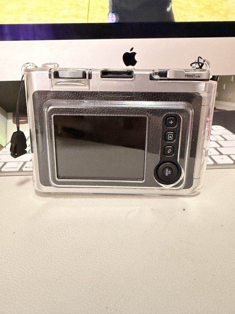 Fujifilm Instax Mini Evo Hybrid Instant Camera (Category: Cameras) located in Pasig City. Submitted by janegar (Listing ID 1454639838, Image 2). Description: - Fujifilm Instax Mini Evo: Hybrid digital and instant camera - Save photos digitally before printing - Comes with a clear protective case & camera cover - Ideal for capturing and instantly printing memories - In excellent working condition.