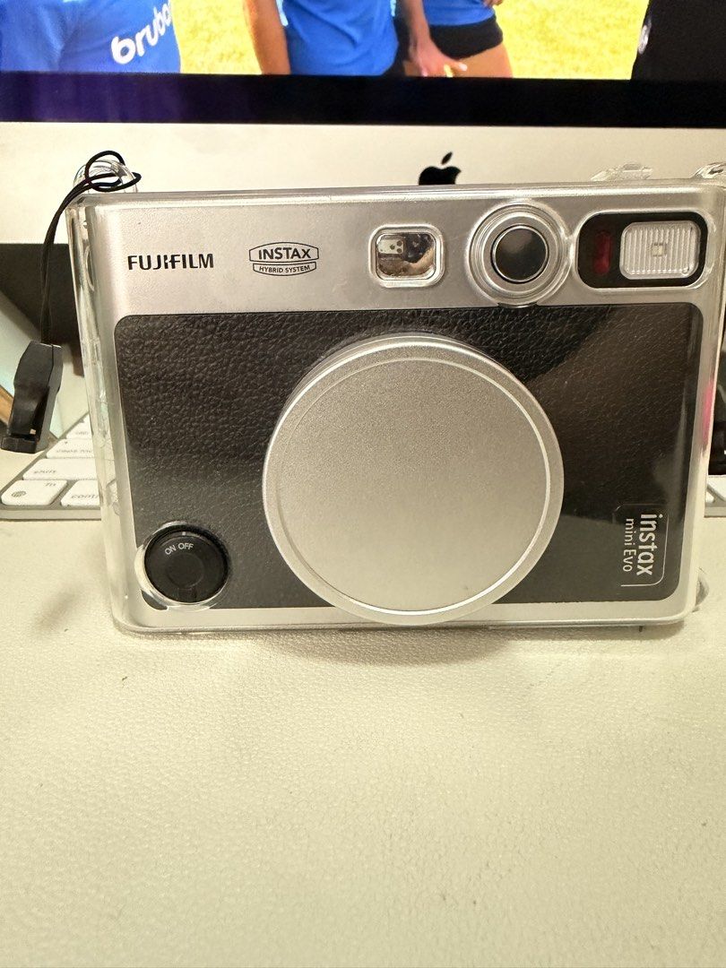 Fujifilm Instax Mini Evo Hybrid Instant Camera (Category: Cameras) located in Pasig City. Submitted by janegar (Listing ID 1454639838, Image 1). Description: - Fujifilm Instax Mini Evo: Hybrid digital and instant camera - Save photos digitally before printing - Comes with a clear protective case & camera cover - Ideal for capturing and instantly printing memories - In excellent working condition.