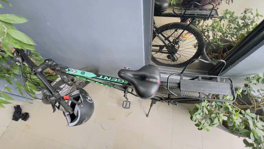 Giant Mountain Bike with Rear Rack (Category: Bicycles) located in Manila. Submitted by gentlefire.1f0e1d (Listing ID 1454618739, Image 2). Description: - Black and green Giant mountain bike - Equipped with a rear rack for carrying essentials - Handlebars feature integrated gear shifters and brake levers - Perfect for both daily commuting and exploring trails.