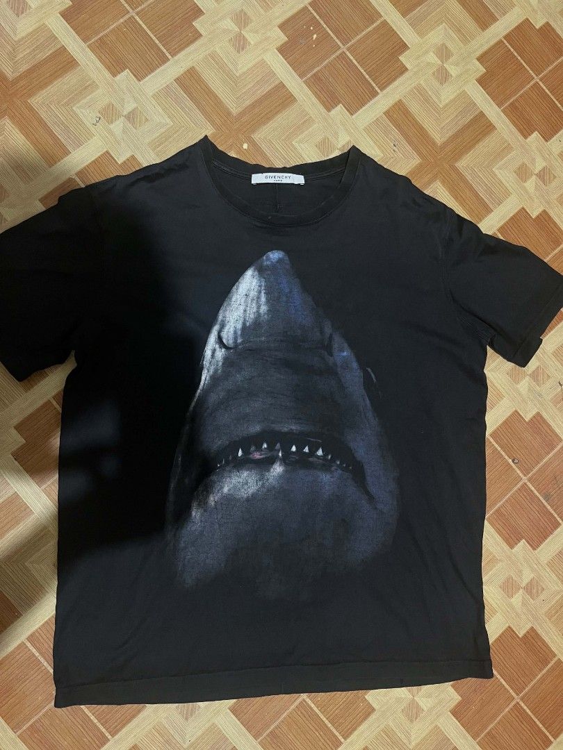 Givenchy Black Shark Print T-Shirt Size M (Category: Tshirts & Polo Shirts ) located in Manila. Submitted by gerardthrifted (Listing ID 1454734717, Image 1). Description: - Brand: Givenchy - Color: Black - Design: Cool shark graphic on front - Material: 100% Cotton - Size: Tagged M - Occasion: Casual wear.