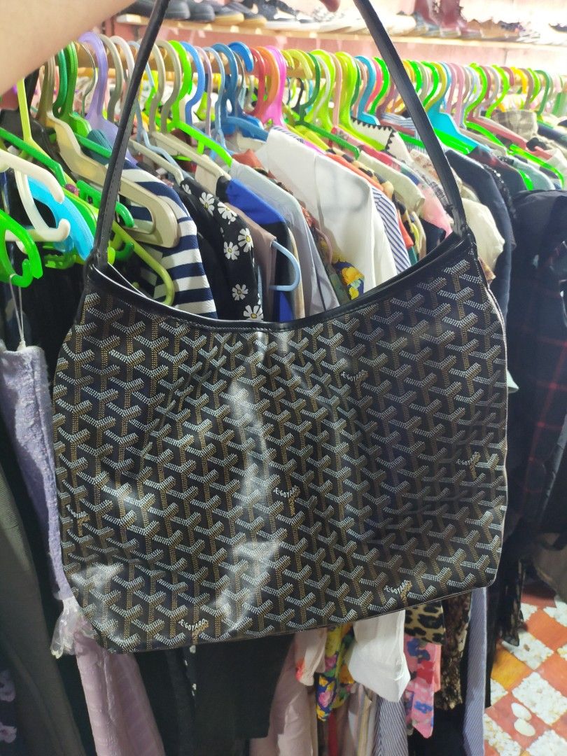 Goyard Hobo Bag (Category: Luxury Bags & Wallets) located in Manila. Submitted by new-opening (Listing ID 1454607525, Image 2). Description: Classic Goyard hobo bag. Features the iconic Goyardine canvas. Spacious interior with a zippered pocket. Comes with a matching pouch. Great for everyday use. Handle is dark brown leather. Bag is dark brown with the signature pattern..