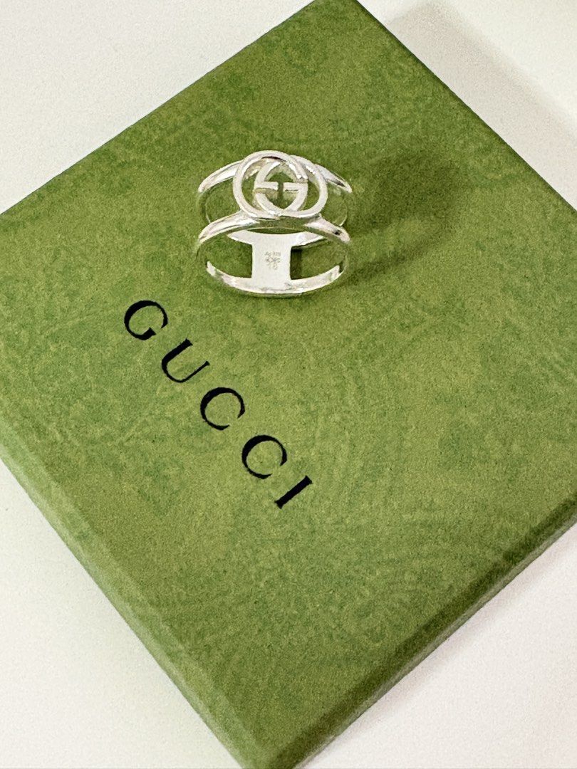 Gucci Interlocking Ring (Category: Rings) located in Singapore. Submitted by cassettepod (Listing ID 1454588799, Image 2). Description: Just sent for polishing, ready to wear. Gucci Interlocking ring size 18, sterling silver 925. Only worn a few times. Comes with full packaging, box & ring pouch. Original price $600, selling for $490, no nego. Only for serious buyers :) .