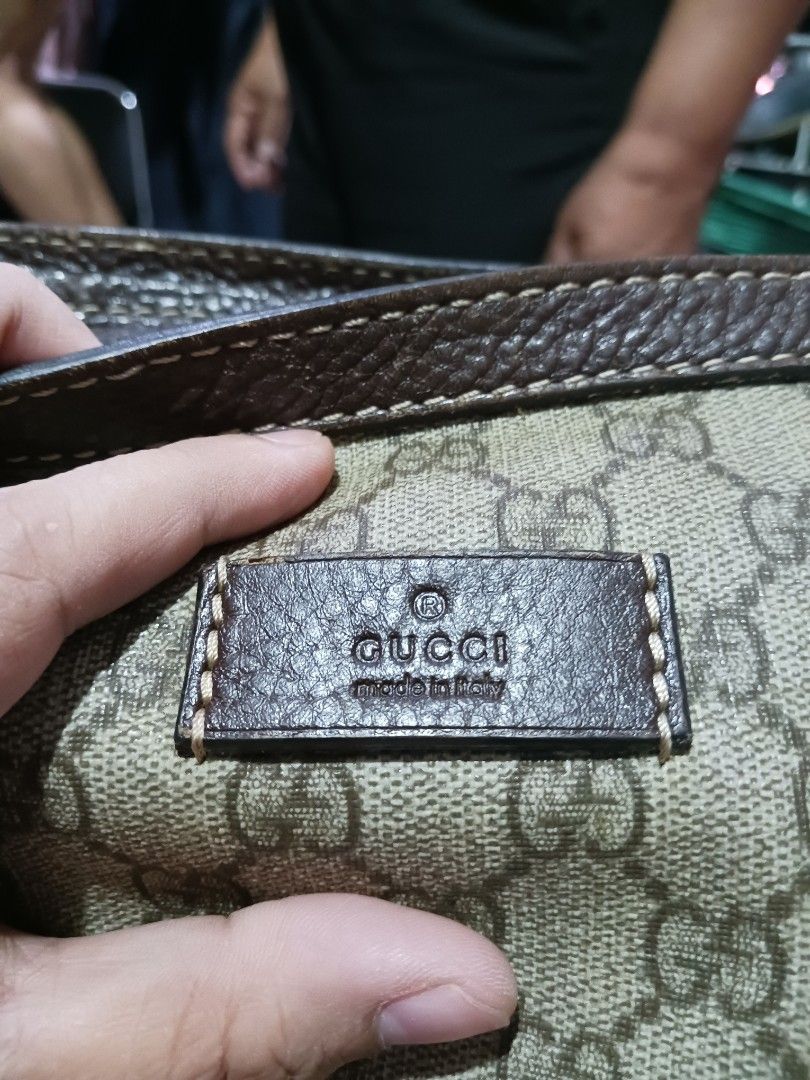 Gucci Monogram Shoulder Bag (Category: Luxury Bags & Wallets) located in Koronadal. Submitted by milagraciaukayukay123_. (Listing ID 1454644673, Image 2). Description: - Authentic Gucci shoulder bag - Classic GG monogram canvas - Brown leather trim - Adjustable strap - Zipper closure - Interior serial number visible - Perfect everyday bag.
