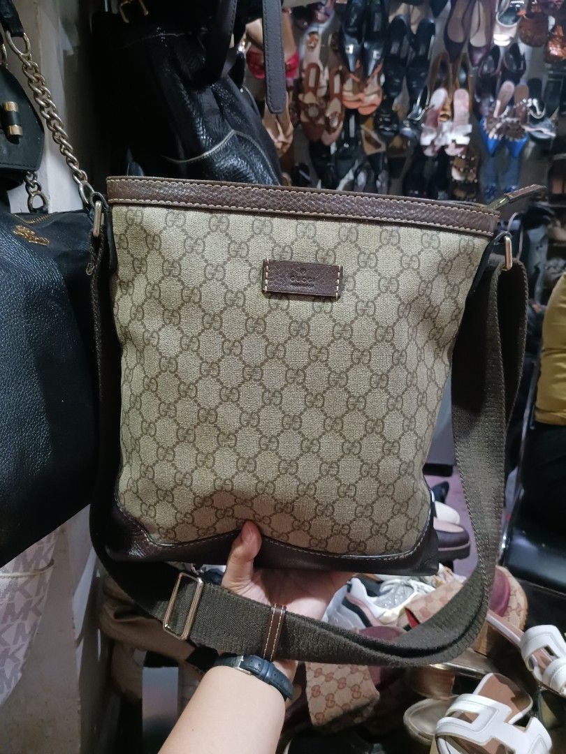 Gucci Monogram Shoulder Bag (Category: Luxury Bags & Wallets) located in Koronadal. Submitted by milagraciaukayukay123_. (Listing ID 1454644673, Image 1). Description: - Authentic Gucci shoulder bag - Classic GG monogram canvas - Brown leather trim - Adjustable strap - Zipper closure - Interior serial number visible - Perfect everyday bag.