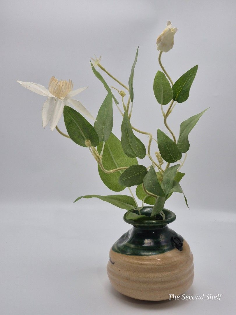 Handmade Ceramic Bud Vase with Green Glaze & Sgraffito Design (Category: Vases & Decorative Bowls) located in Santa Rosa. Submitted by thesecondshelf (Listing ID 1454625010, Image 2). Description: Handmade Ceramic Bud Vase with Green Glaze & Sgraffito Design PHP 350 A charming handmade ceramic vase with a rounded form, natural stoneware finish, deep green glazed neck, and simple hand-drawn botanical details. The small loop detail on the side adds