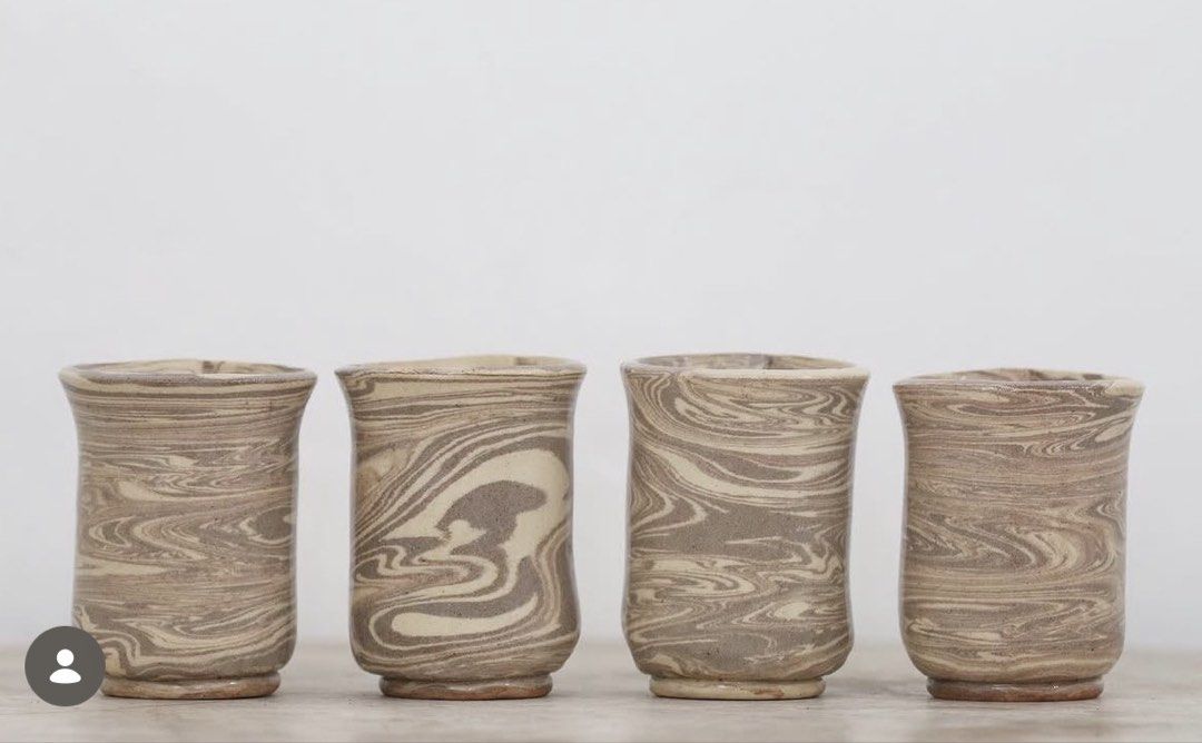 Handmade Ceramic Cups (Category: Coffee & Tea Tableware) located in Malolos. Submitted by irisandbarry (Listing ID 1454734033, Image 2). Description: - Set of unique handmade ceramic cups - Beautiful marbled swirl pattern in brown and beige tones - Each cup features a slightly different design - Ideal for morning coffee or tea - Adds rustic charm to your kitchenware - Japanwares Php.60-100 each.