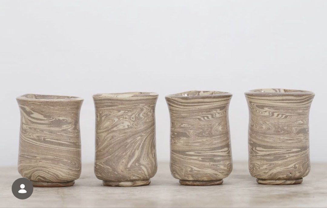 Handmade Ceramic Cups (Category: Coffee & Tea Tableware) located in Malolos. Submitted by irisandbarry (Listing ID 1454734033, Image 3). Description: - Set of unique handmade ceramic cups - Beautiful marbled swirl pattern in brown and beige tones - Each cup features a slightly different design - Ideal for morning coffee or tea - Adds rustic charm to your kitchenware - Japanwares Php.60-100 each.