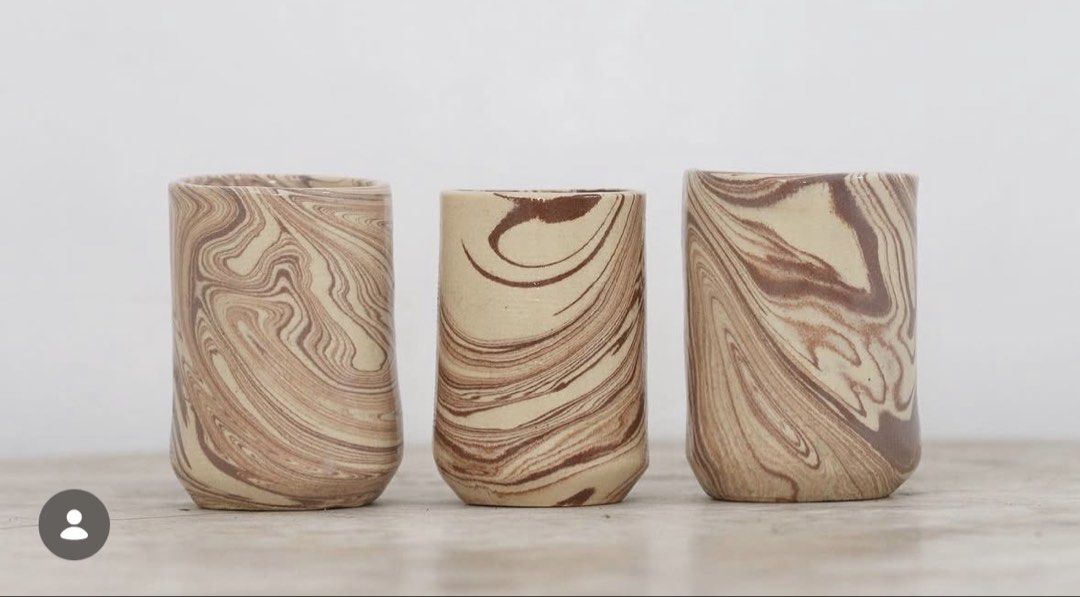 Handmade Ceramic Cups (Category: Coffee & Tea Tableware) located in Malolos. Submitted by irisandbarry (Listing ID 1454734033, Image 1). Description: - Set of unique handmade ceramic cups - Beautiful marbled swirl pattern in brown and beige tones - Each cup features a slightly different design - Ideal for morning coffee or tea - Adds rustic charm to your kitchenware - Japanwares Php.60-100 each.