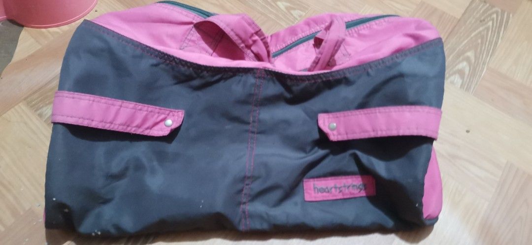 Heartstrings Pink and Black Duffel Bag (Category: Shoulder Bags) located in Rodriguez. Submitted by johnpatrickzxc (Listing ID 1454714875, Image 2). Description: - Chic pink and black duffel bag - Two convenient side pockets with snap closures - Main compartment securely zips open - Durable, sturdy handles for comfortable carrying - Ideal for gym sessions or weekend getaways - Ample space for all your essentials - Large storage for every kind of 