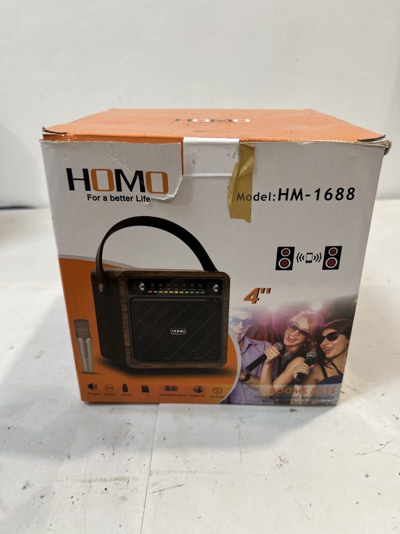 HOMO Portable Karaoke Speaker with Microphone (Category: Soundbars, Speakers & Amplifiers) located in Quezon City. Submitted by mitchabrio (Listing ID 1454606331, Image 3). Description: - Retro wood grain finish for a stylish look - Includes a gold microphone for karaoke fun - Adjustable volume and echo controls - Easy-to-use buttons: Mode, Play/Pause, Skip - LED dimmer for customizable lighting - Connect your device and get the party started!.