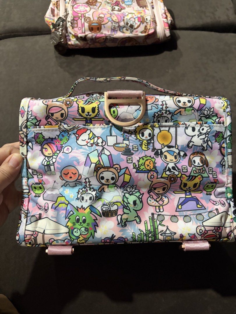 Jujube Toki Retreat bestie (Category: Purses & Pouches) located in Baguio. Submitted by nijnij15 (Listing ID 1454602824, Image 3). Description: - Super cute Jujube x Tokidoki cosmetic bag - Ideal for storing makeup or travel essentials - Includes a convenient top handle - Front zippered pocket for quick access - Stylish rose gold zipper pulls - Surprisingly spacious interior.