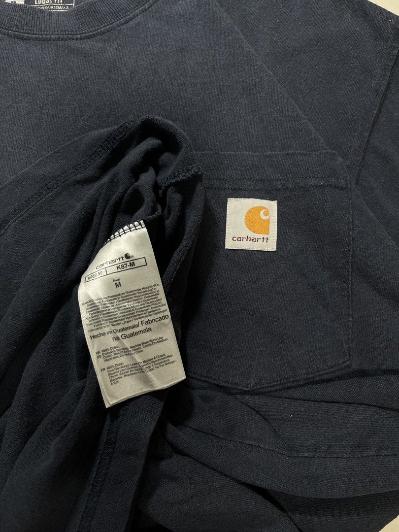 K87 CARHARTT POCKET TEE (Category: Tshirts & Polo Shirts ) located in Bangued. Submitted by seconde_official (Listing ID 1454730137, Image 3). Description: Size: Medium - Large Length: 31 inches Width: 24 inches Color rate: 8/10 Issue: No issue.
