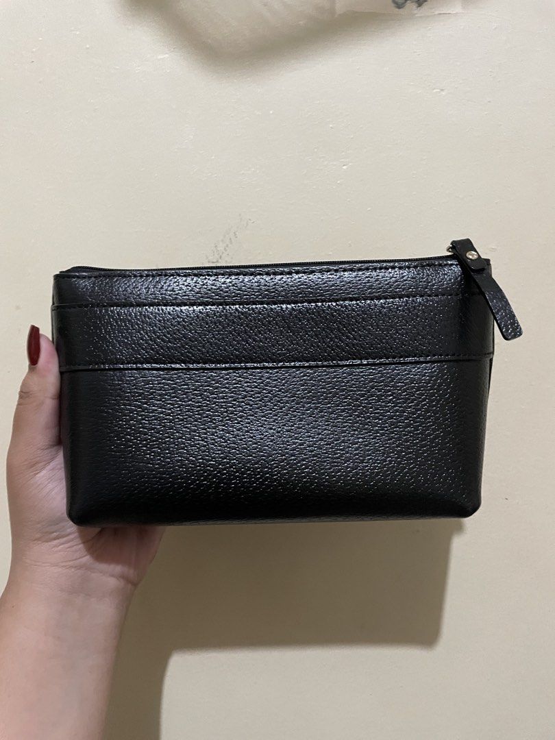 Kate Spade Black Leather Bow Pouch (Category: Purses & Pouches) located in Magalang. Submitted by bncdb (Listing ID 1454667317, Image 2). Description: - lightly used, in very good condition - can be a makeup pouch or a clutch - very spacious .