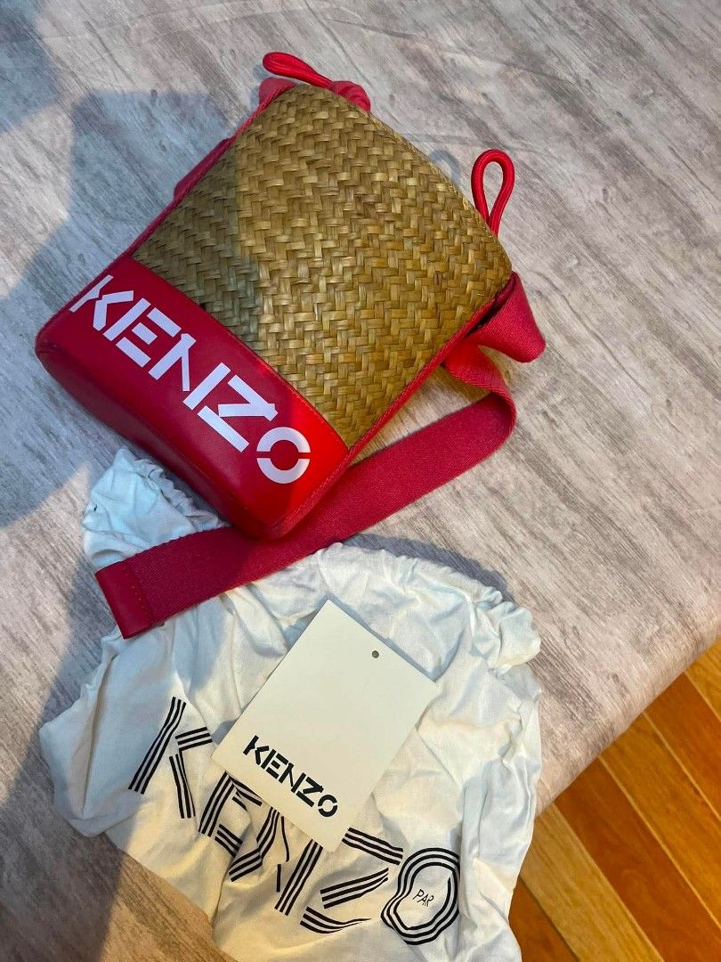 Kenzo Straw Bag with Red Leather Trim (Category: Luxury Bags & Wallets) located in Marikina City. Submitted by kgcdl (Listing ID 1454722497, Image 1). Description: - Adorable Kenzo straw bag - Features red leather trim - Iconic white KENZO logo - Comes with a drawstring dust bag.