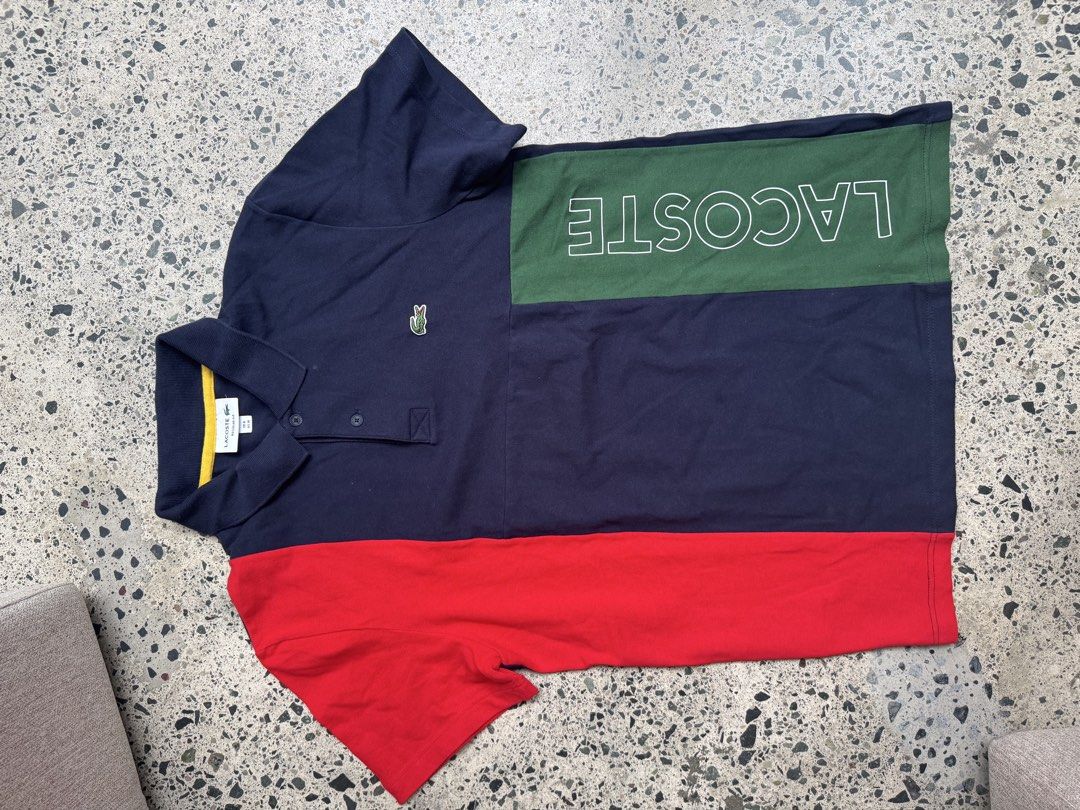 Lacoste Colourblock Polo Shirt (Category: Tshirts & Polo Shirts ) located in Manila. Submitted by rb.declutters (Listing ID 1454594530, Image 1). Description: - Classic size 4 Lacoste polo shirt - Bold navy, green, and red colorblock design - Embroidered Lacoste crocodile logo on chest - Button-up collar - Ideal for casual wear.