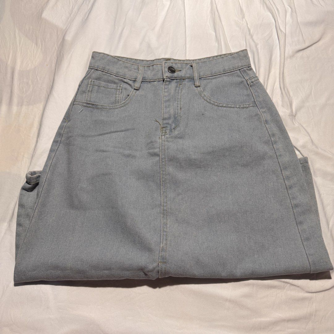 Light Wash Denim Midi Skirt with Front Slit (Category: Skirts) located in Rizal. Submitted by zlaaa_ (Listing ID 1454678439, Image 2). Description: - Light wash denim midi skirt - Front slit for easy movement - Classic five-pocket styling - Button and zip closure - Versatile for casual, everyday wear 📍Loc: Rod. Rizal 🚚 MOD: J&T, Lalamove (buyer shoulders shipping) 💳 MOP: Gcash, Maribank, or Bank Transfer ❗️Payment First Swipe for more photos M