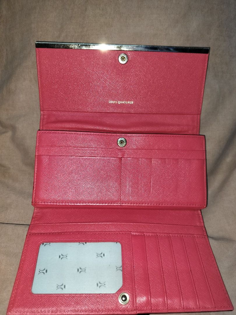 Louis Quatorze Black Leather Long Wallet (Category: Wallets & Card holders) located in Caloocan City. Submitted by jennielz (Listing ID 1454577922, Image 3). Description: - Authentic Louis Quatorze wallet - Black textured leather exterior - Elegant gold hardware - Vibrant bright pink interior - Multiple card slots for easy organization - Secure zippered coin pocket - Comes with authenticity card - Ideal for everyday essentials -minimal sign of us