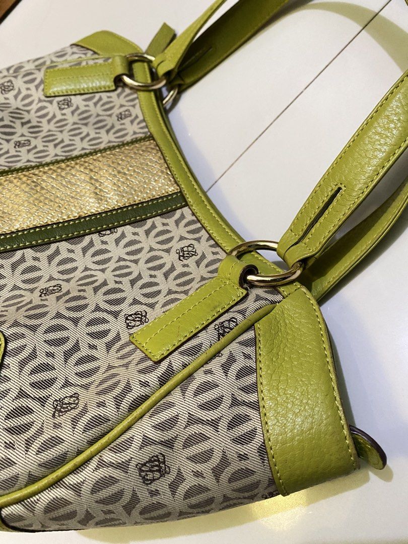 Louis Quatorze Monogram Shoulder Bag (Category: Luxury Bags & Wallets) located in Marikina City. Submitted by heaven.2397 (Listing ID 1454675972, Image 2). Description: - Lime green Louis Quatorze shoulder bag - Signature monogram pattern - Gold accent strip in the middle - Leather trim and handles - Multiple interior pockets - Zipper closure - Ideal for everyday use I got this bag secondhand for 1500 and selling it for only 500 since im declutte
