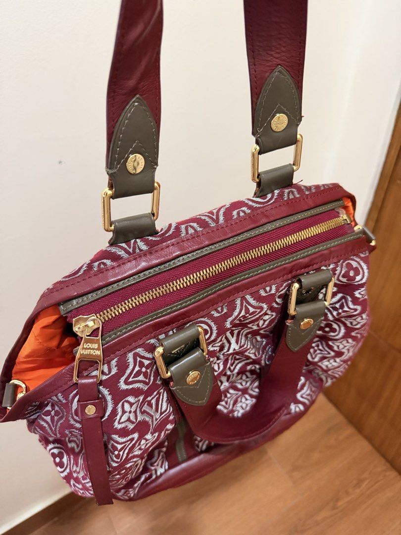 LV Bag (Category: Luxury Bags & Wallets) located in Quezon City. Submitted by trishanelle (Listing ID 1454717954, Image 2). Description: - Authentic Louis Vuitton Speedy bag - Classic burgundy and white monogram pattern - Genuine leather trim and handles - Elegant gold hardware - Secure zipper closure - Striking orange interior - Ideal for everyday use.