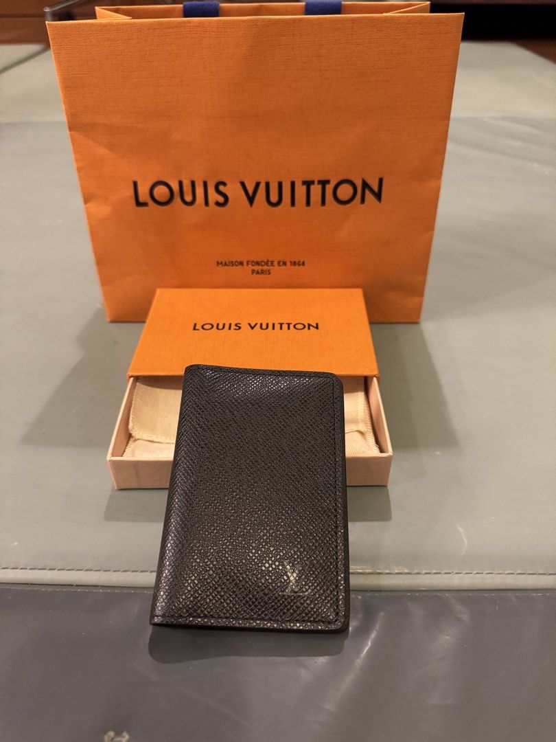 Louis Vuitton pocket organizer/card holder (Category: Luxury Bags & Wallets) located in Bacoor. Submitted by mlgon1 (Listing ID 1454689256, Image 1). Description: Brand new black pocket organizer. From Louis Vuitton in Changi Airport, Singpore. Comes with box, paper bag & two tester vials of LV perfume. SRP 29,700 .
