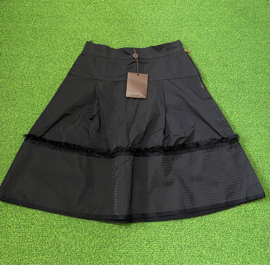 Louis Vuitton Skirt (Category: Luxury Apparel) located in Manila. Submitted by victory_1816 (Listing ID 1454633884, Image 2). Description: Elegant and timeless Louis Vuitton skirt, size 38, in classic black. Beautifully designed with a feminine silhouette, quality detailing, and signature Louis Vuitton finishing. ⭐️Made in France ⭐️Size 38 ⭐️70% Polyester / 30% Silk ⭐️Gold tone LV hardware and zipper ⭐️Comes with Louis Vuitton care card, extra th