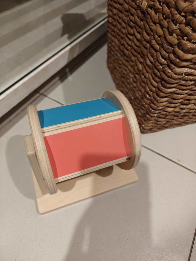 Lovevery spinning wheel (Category: Infant Playtime) located in Manila. Submitted by asianbutte89964 (Listing ID 1454568901, Image 1). Description: - Wooden roller toy with vibrant blue and red panels. - Features a smooth wooden base and sides for safe play. - Perfect for little ones to explore and develop motor skills. - Classic and simple design ideal for sensory exploration..