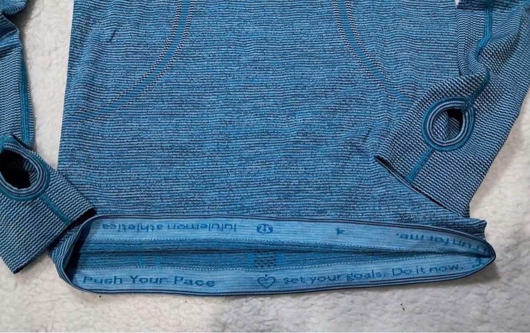 Lululemon Athletica Long Sleeve Top Size 4 Blue (Category: Activewear) located in Baguio. Submitted by padisellsz (Listing ID 1454640981, Image 2). Description: - Blue Lululemon long sleeve top - Very good condition - Mejo nabubura lang yung logo sa likod - Size 4 (fits like a Small to Medium) - Features thumbholes for added warmth - "Push Your Pace" and "set your goals. Do it now." printed on the hem - Versatile for workouts or casual wear.