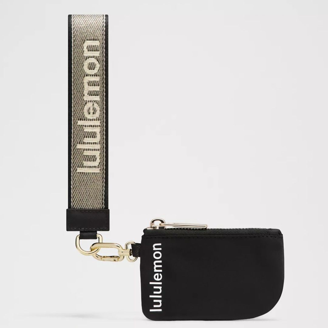 Lululemon Dual Pouch Wristlet Set Black/Gold (Category: Purses & Pouches) located in Bulacan. Submitted by bnbig (Listing ID 1454593519, Image 3). Description: - Lululemon Dual Pouch Wristlet Set - Includes two black zippered pouches - One pouch is semi-circular, the other is rectangular - Comes with a branded wrist strap featuring the Lululemon logo - Ideal for organizing small essentials.