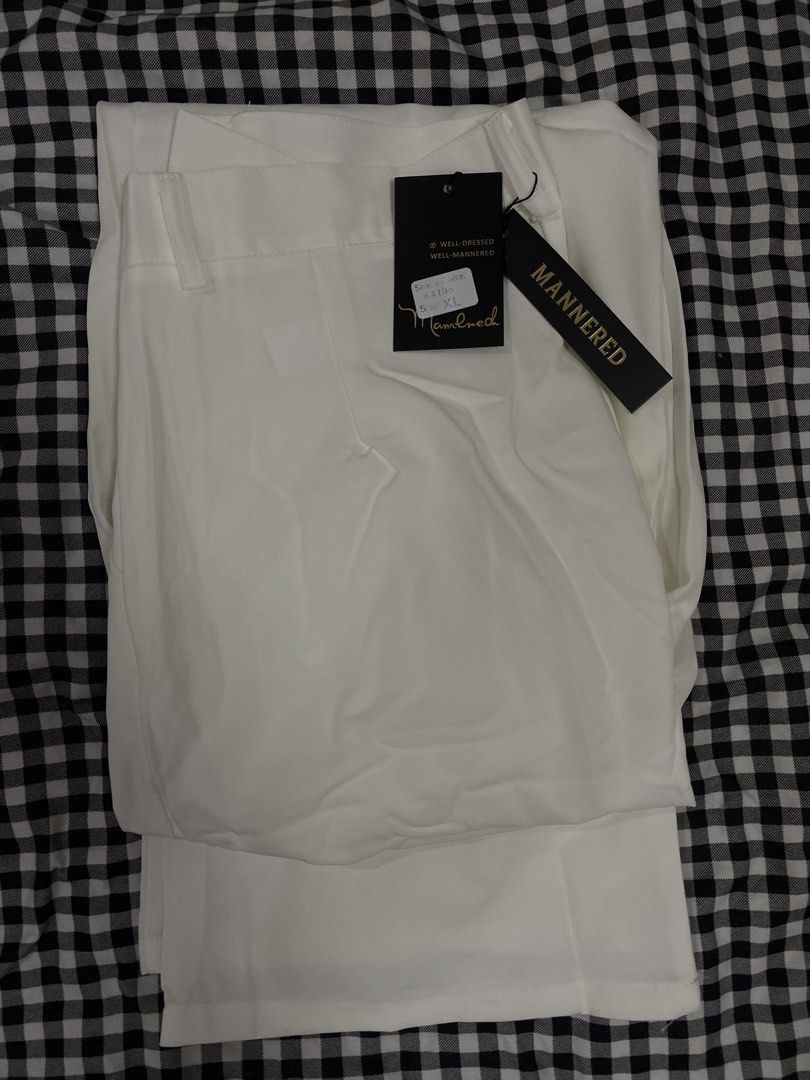 MANNERED White Trousers XL (Category: Trousers) located in Manila. Submitted by lev777 (Listing ID 1454723796, Image 1). Description: - Brand: MANNERED - Color: White - Size: XL (tag) - Fit: Straight leg - Material: Smooth fabric - Condition: Brand new, never worn, with tags attached - Versatility: Great for dressing up or down Dimensions Width - 32-34 Length - 40 RFS: Decluttering SF care of buyer Feel free to message/negotiate with me.