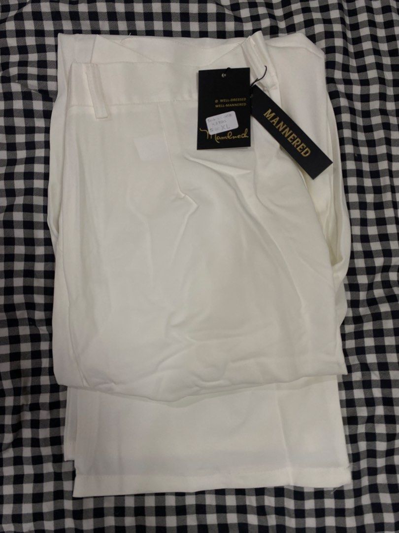 MANNERED White Trousers XL (Category: Trousers) located in Manila. Submitted by lev777 (Listing ID 1454723796, Image 2). Description: - Brand: MANNERED - Color: White - Size: XL (tag) - Fit: Straight leg - Material: Smooth fabric - Condition: Brand new, never worn, with tags attached - Versatility: Great for dressing up or down Dimensions Width - 32-34 Length - 40 RFS: Decluttering SF care of buyer Feel free to message/negotiate with me.