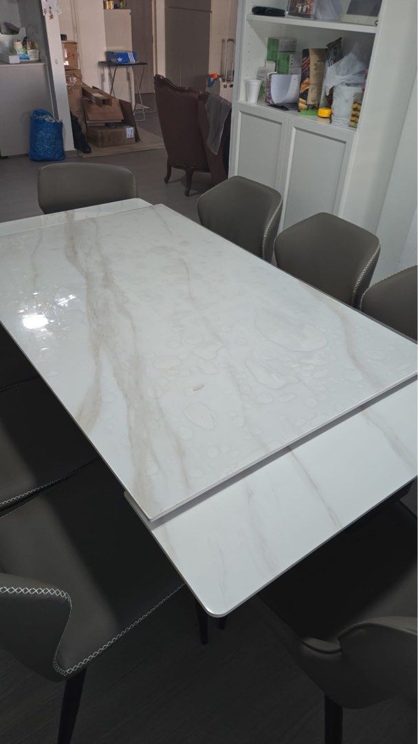 Dining Table (Category: Tables & Sets) located in Singapore. Submitted by shidxh (Listing ID 1454566599, Image 2). Description: - Marble effect dining table with glossy finish - Comfortably seats 6 people - Extandable up to 2m, seats 8 people. Before extending: 1.4m x 90cm - Selling dining table only - Ideal for family meals and entertaining - Fast deal with delivery - Nego (delivery not provided).