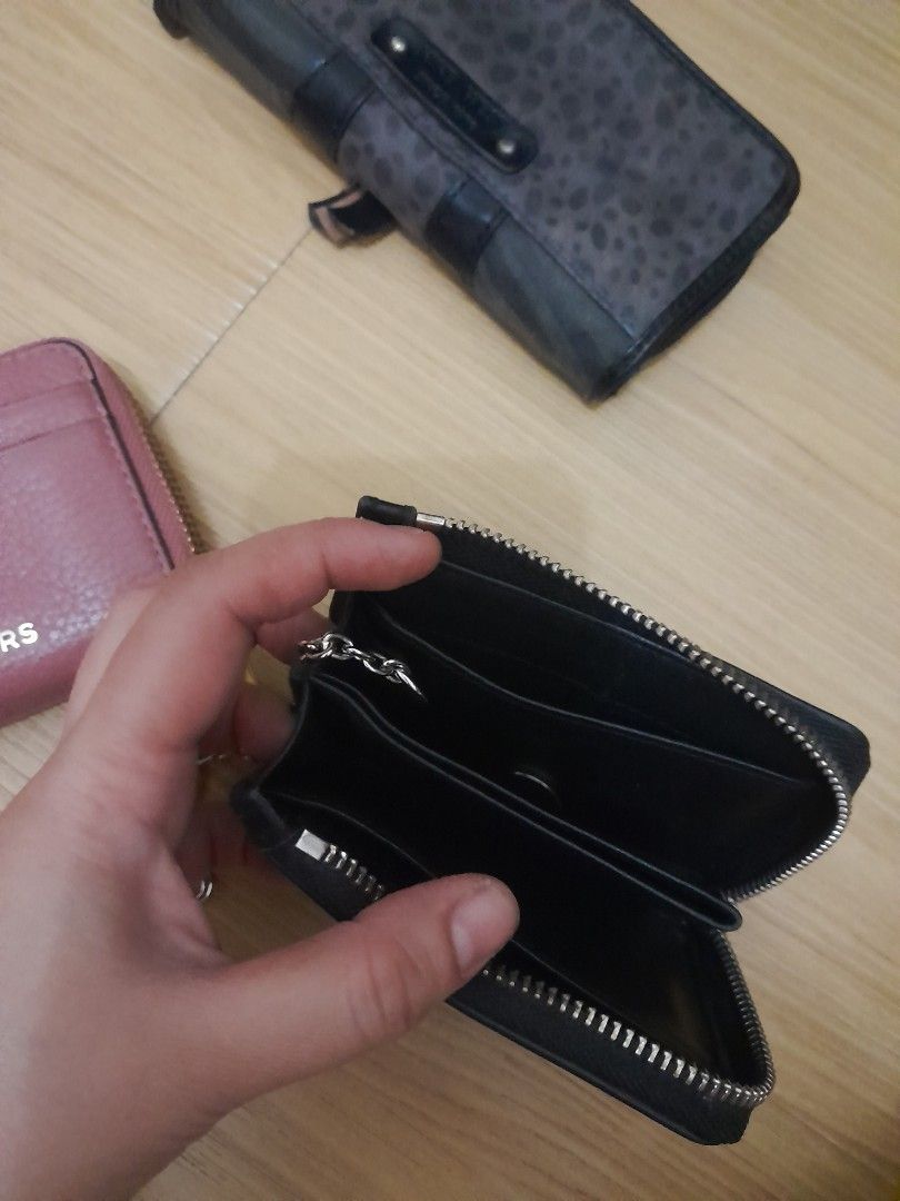 Michael Kors, Nine West, and ck wallet (Category: Wallets & Card holders) located in Angeles City. Submitted by declutterhub (Listing ID 1454701777, Image 3). Description: - Michael Kors coin purse in dusty rose P1,000 - ck lack zip-around wallet (brand unknown) P800 - Black Nine West wallet with card slots and snap closure P700 rfs: decluttering .