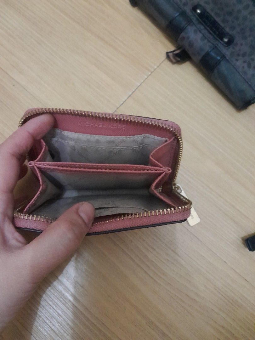 Michael Kors, Nine West, and ck wallet (Category: Wallets & Card holders) located in Angeles City. Submitted by declutterhub (Listing ID 1454701777, Image 2). Description: - Michael Kors coin purse in dusty rose P1,000 - ck lack zip-around wallet (brand unknown) P800 - Black Nine West wallet with card slots and snap closure P700 rfs: decluttering .