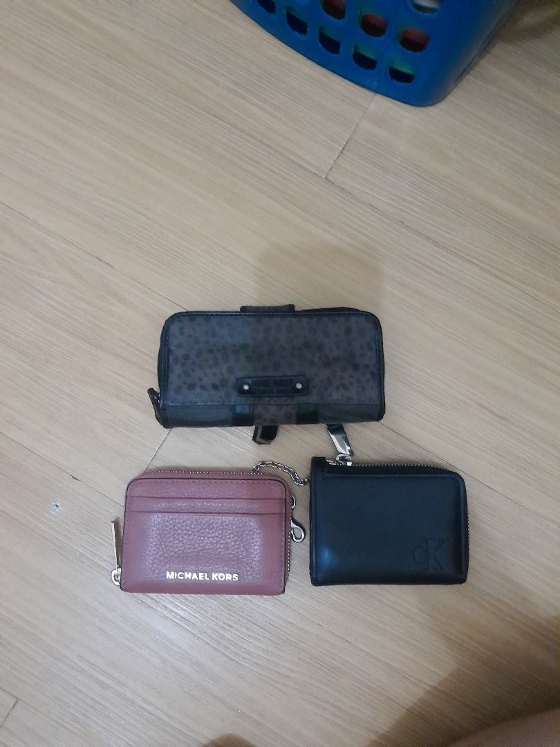 Michael Kors, Nine West, and ck wallet (Category: Wallets & Card holders) located in Angeles City. Submitted by declutterhub (Listing ID 1454701777, Image 1). Description: - Michael Kors coin purse in dusty rose P1,000 - ck lack zip-around wallet (brand unknown) P800 - Black Nine West wallet with card slots and snap closure P700 rfs: decluttering .