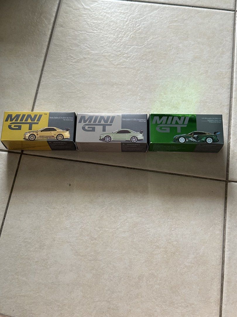 mini gt (Category: Vehicle & Diecast Models) located in Singapore. Submitted by spinnnyi (Listing ID 1454599521, Image 1). Description: left mini gt - $30 middle mini gt - $30 right mini gt - $40.