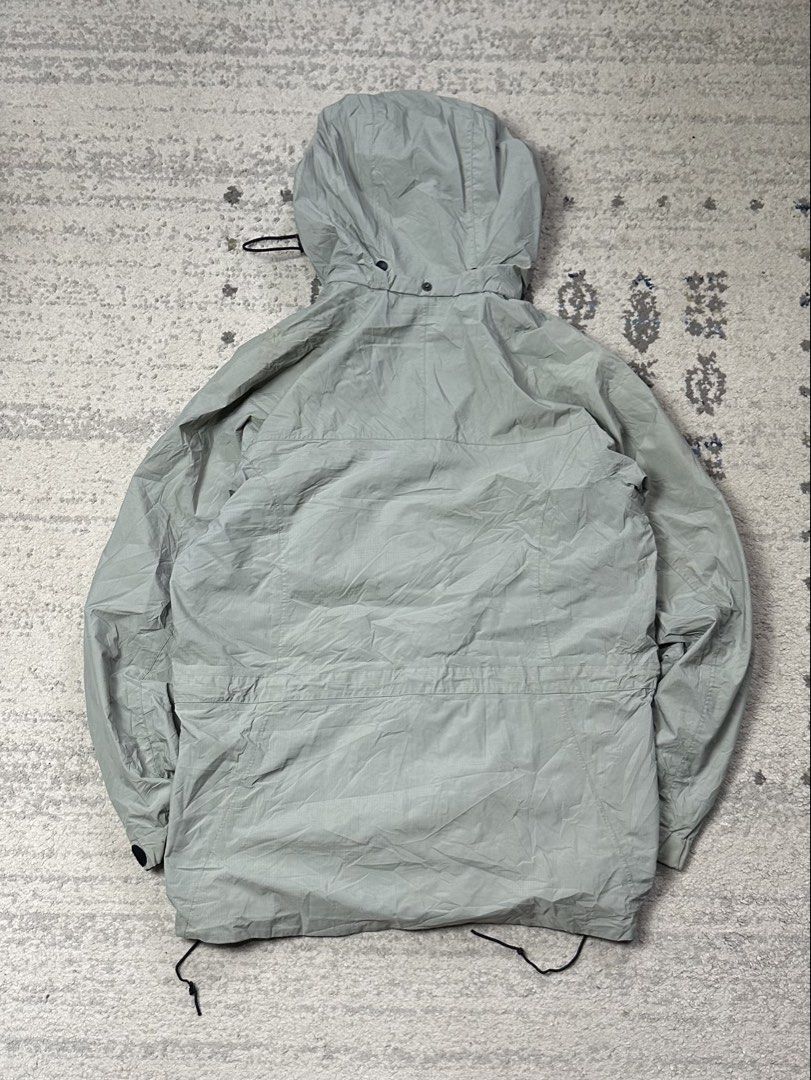 Mountain Equipment Co-op Rain Jacket (Category: Coats, Jackets and Outerwear) located in Daet. Submitted by thrifthings2018 (Listing ID 1454643025, Image 3). Description: - Lightweight rain jacket from Mountain Equipment Co-op (MEC) - Features a hood with adjustable drawstrings at the waist and hem - Button-up front closure - Versatile for outdoor adventures or everyday use - Measurements: 23 inches wide, 30 inches long.